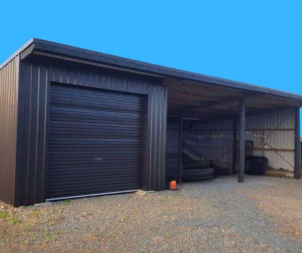 Metal-clad shed with a roller garage door.