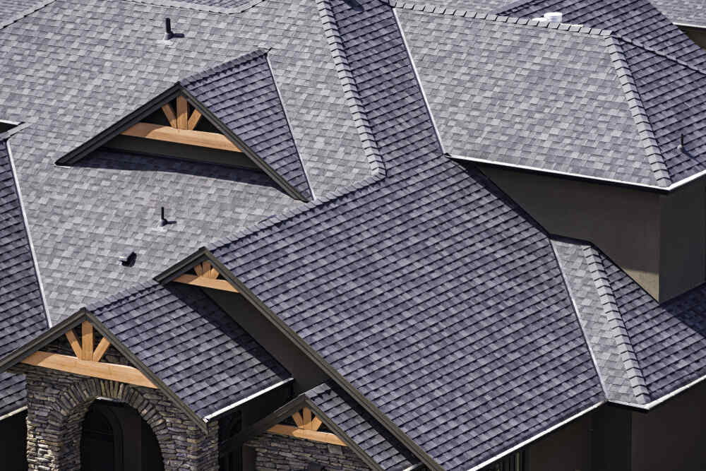 A roof with multi-toned grey luxury shingles